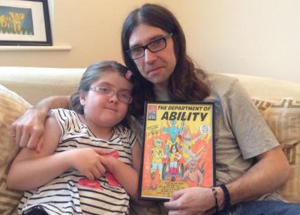 Dan & Emily White, with a preliminary proof of their comic book.